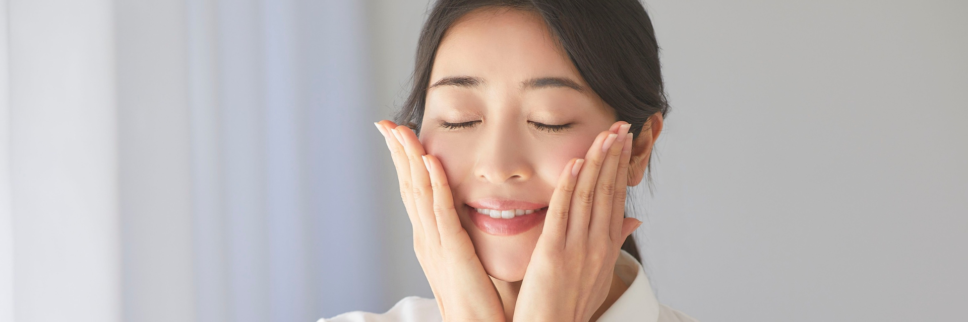 Woman with healthy-looking glowing skin at a medical aesthetics clinic in Richmond BC